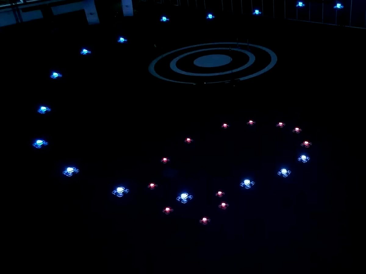 Drones holding a heart-shaped formation, seen from above